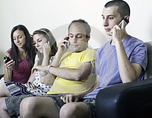 Group of young people on cellphones