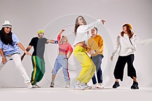 Group of young people dancing with pleasure