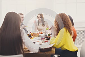 Group of young people at dinner table, friends party