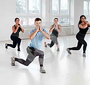 Group of young people doing fitness exercices