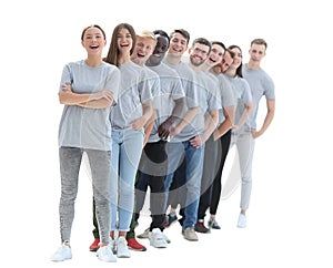 Group of young people in gray t-shirts standing in a row