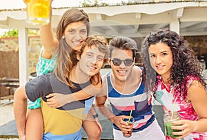 Group of young people having fun in summer party