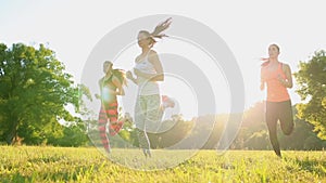 Group of young people having kick boxing training , outdoor