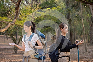 Group of young people hiking trough forest.Outdoors nature concept.