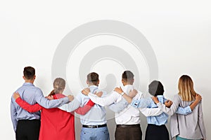 Group of young people hugging each other