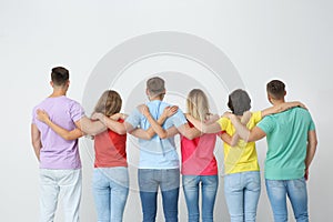 Group of young people hugging each other