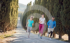 Group of young people jogging with smile
