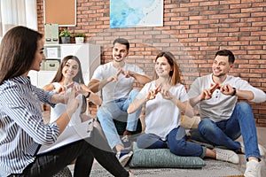 Group of young people learning sign language