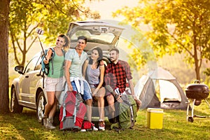 Group of young people making selfie portrait on camping trip