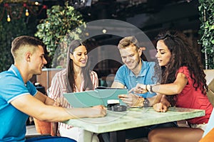 Group of young people meeting in a cafe