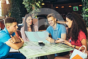 Group of young people meeting in a cafe