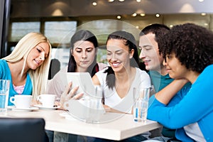 Group of young people in modern cafe