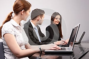 Group of young people in the office working togeth