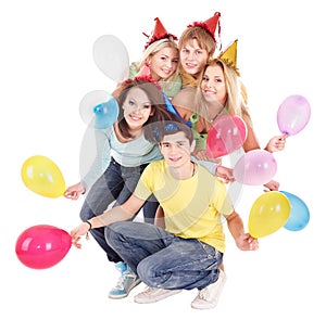 Group of young people in party hat.