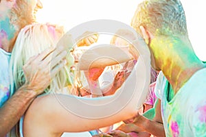 Group of young people playing in swimming pool party outdoor - Multi ethnic cheerful friends enjoying aqua park in summer time -