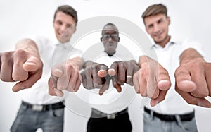 Group of young people pointing at you