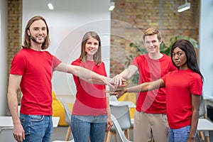 Group of young people in red tshirts indoors