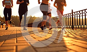 A group of young people runs along the road in the park.