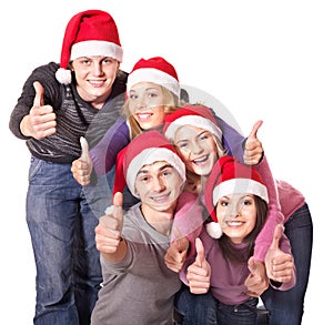 Group young people in santa hat show thumbs up.