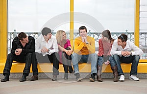 Group of young people sit