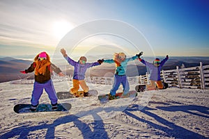 Group of young people with snowboard