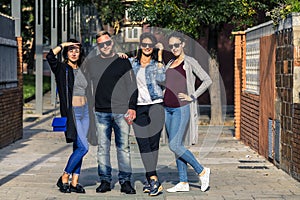 Group of young people standing on the ghetto street.