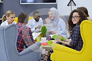 Group of young people, Startup entrepreneurs working on their venture in coworking space photo