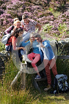 Group Of Young People Taking Photograph On Hike