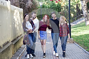 Group of young people together outdoors in urban background