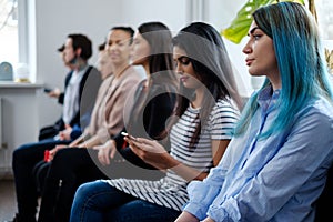 Group of young people waiting for a casting or job interview