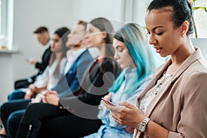 Group of young people waiting for a casting or job interview