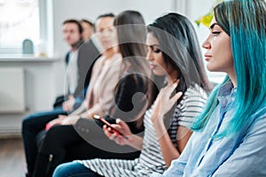 Group of young people waiting for a casting or job interview