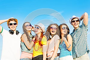 Group of young people wearing sunglasses and hat