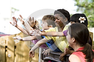 Group of young preschool children playing