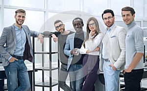 Group of young professionals standing in the office