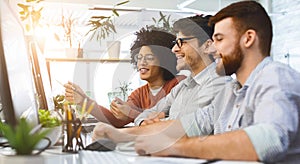 Group of young programmers developing data code