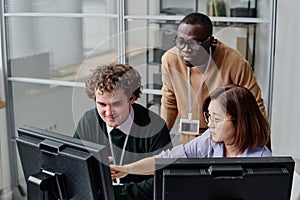 Team of developers working with codes