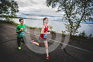 Group of Young Runners and Kids Racing Together