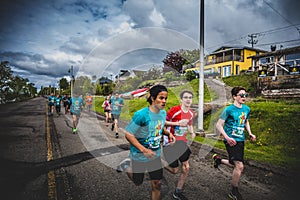 Group of Young Runners and Kids Racing Together