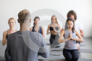 Group of young sporty people in seiza pose