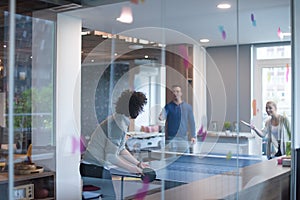 Startup business team playing ping pong tennis