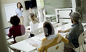 Students rising hands to answer the question during the workshop training