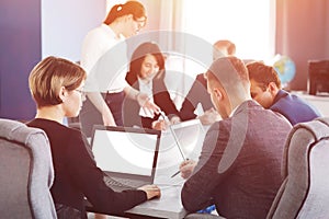 Group of young successful businessmen lawyers communicating together in a conference room while working on a project