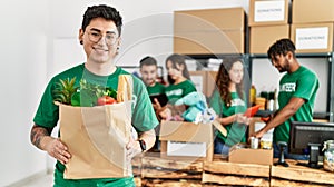 Group of young volunteers working at charity center