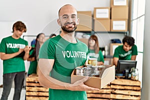 Group of young volunteers working at charity center