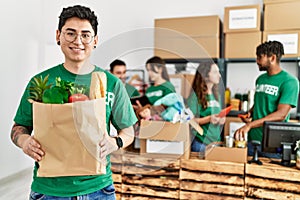 Group of young volunteers working at charity center