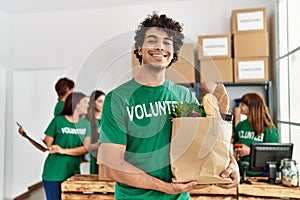 Group of young volunteers working at charity center