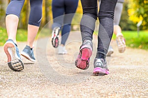 Group of young woman jogging together in a park