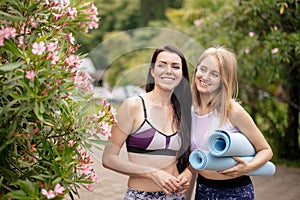 Group of young woman relaxing after outdoor training in park