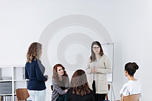 Group of young women talking sitting in a circle. Psychological support concept